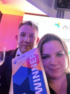 Olsights co-founders Rosie Griffiths and Tony Griffiths Proudly showing off the Best Tech Company 2024 Trophy at the West London Chambers Business Awards